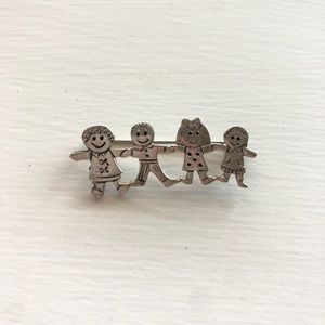Sterling silver brooch with four children